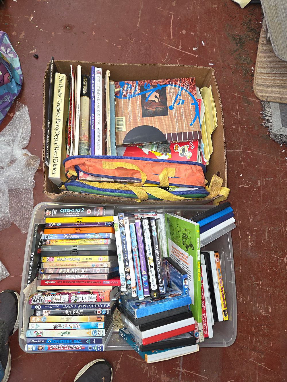 Lot 258 – Two Boxes of Miscellaneous Books, Magazines, Sheet Music, and Family DVDs