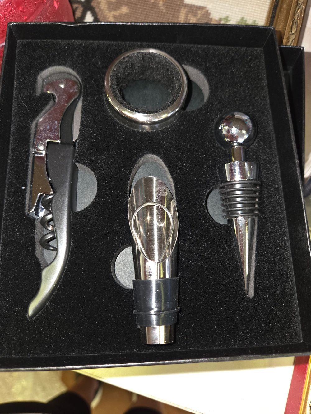 Lot 413 – A Set of Contemporary Polished Metal Wine Accessories in a Presentation Box