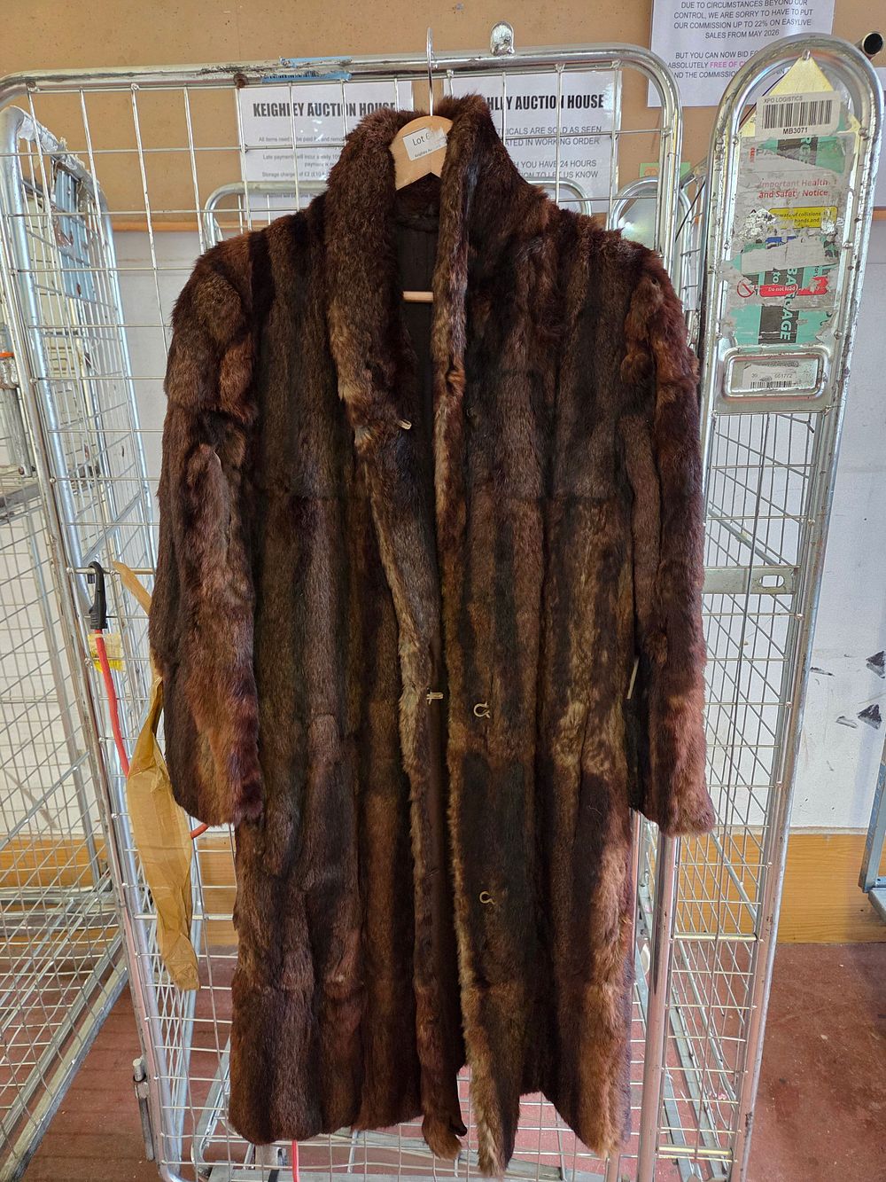 Lot 424 – A mid-20th century full-length mahogany brown fur coat