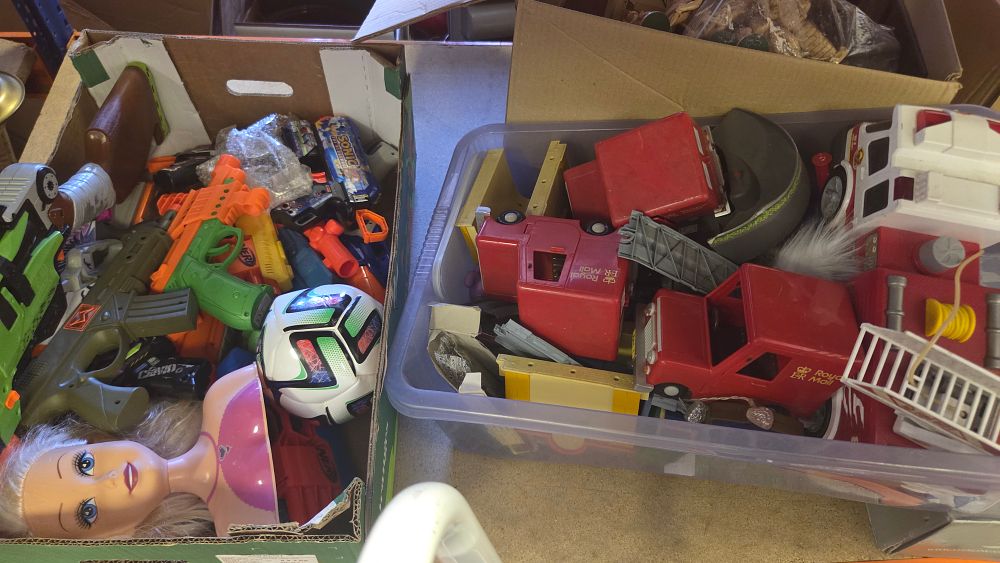Lot 206 – Two Boxes of Toy Vehicles and Firearms Including Postman Pat and Nerf Branding