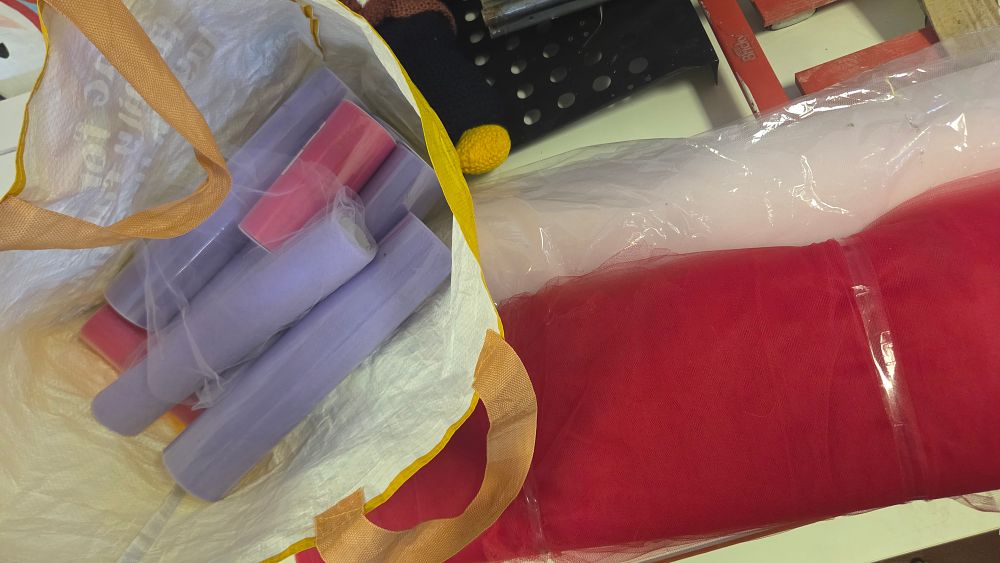 Lot 242 – An Assortment of Decorative Tulle Fabric Rolls in Various Colours