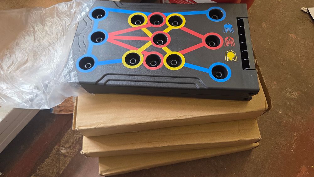 Lot 283 – An Assortment of Portable Foldable Colour-Coded Push-Up Training Boards