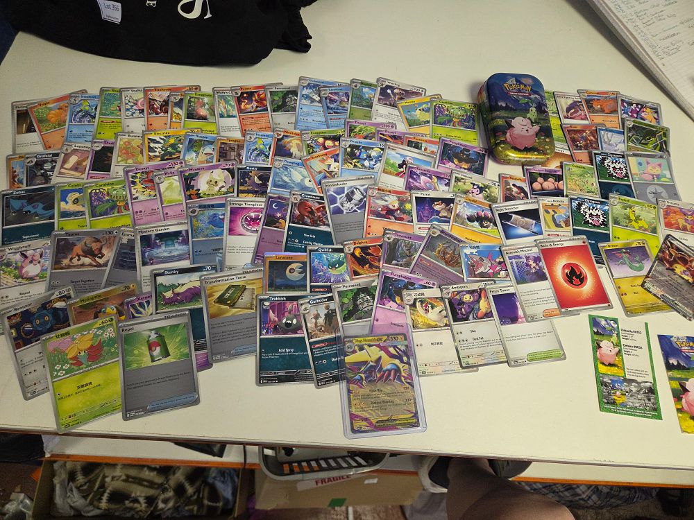 Lot 357 – A Collection of Pokémon Trading Card Game Cards and a Metal Storage Tin