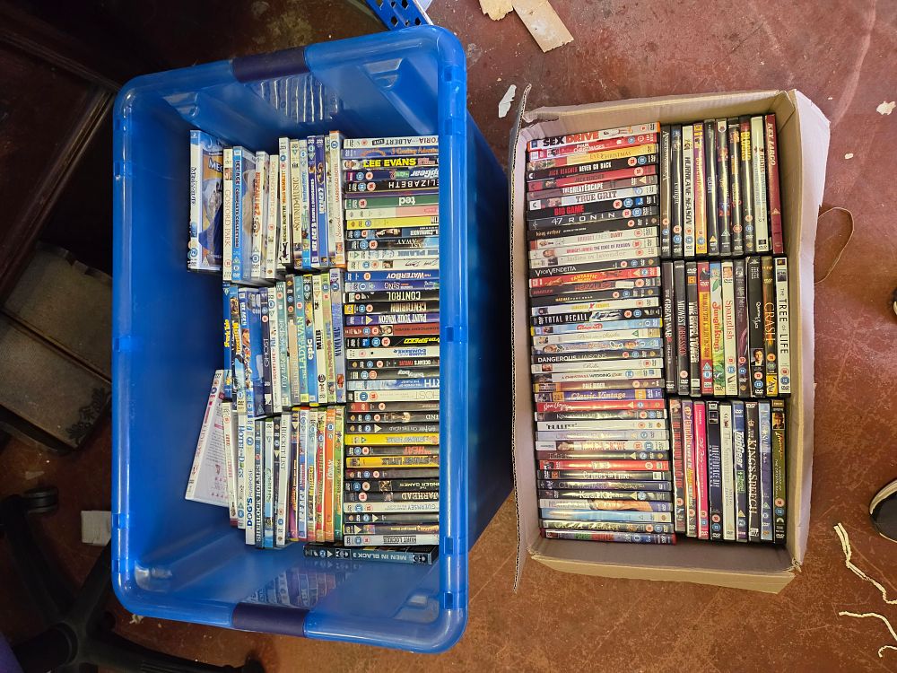 Lot 390 – A Large Collection of Assorted DVDs in Storage Containers