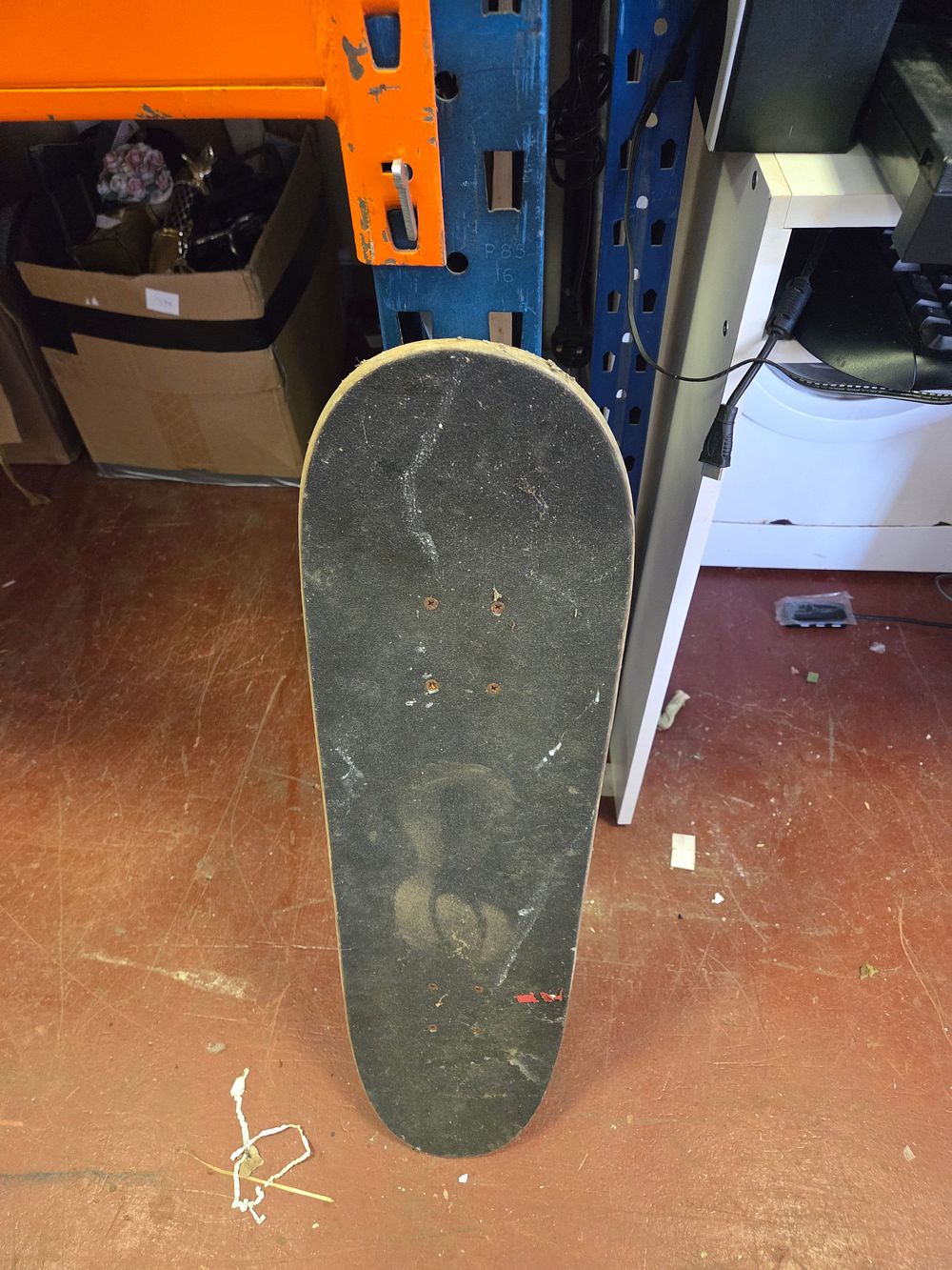 Lot 392 – A Complete Skateboard with Sticker-Decorated Deck