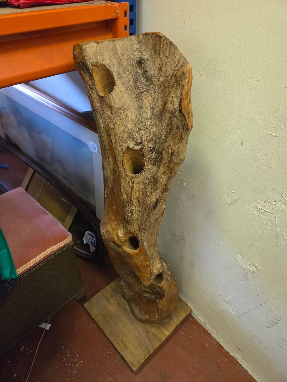 Lot 394 – A Rustic Carved Hardwood Floor-Standing Wine Rack