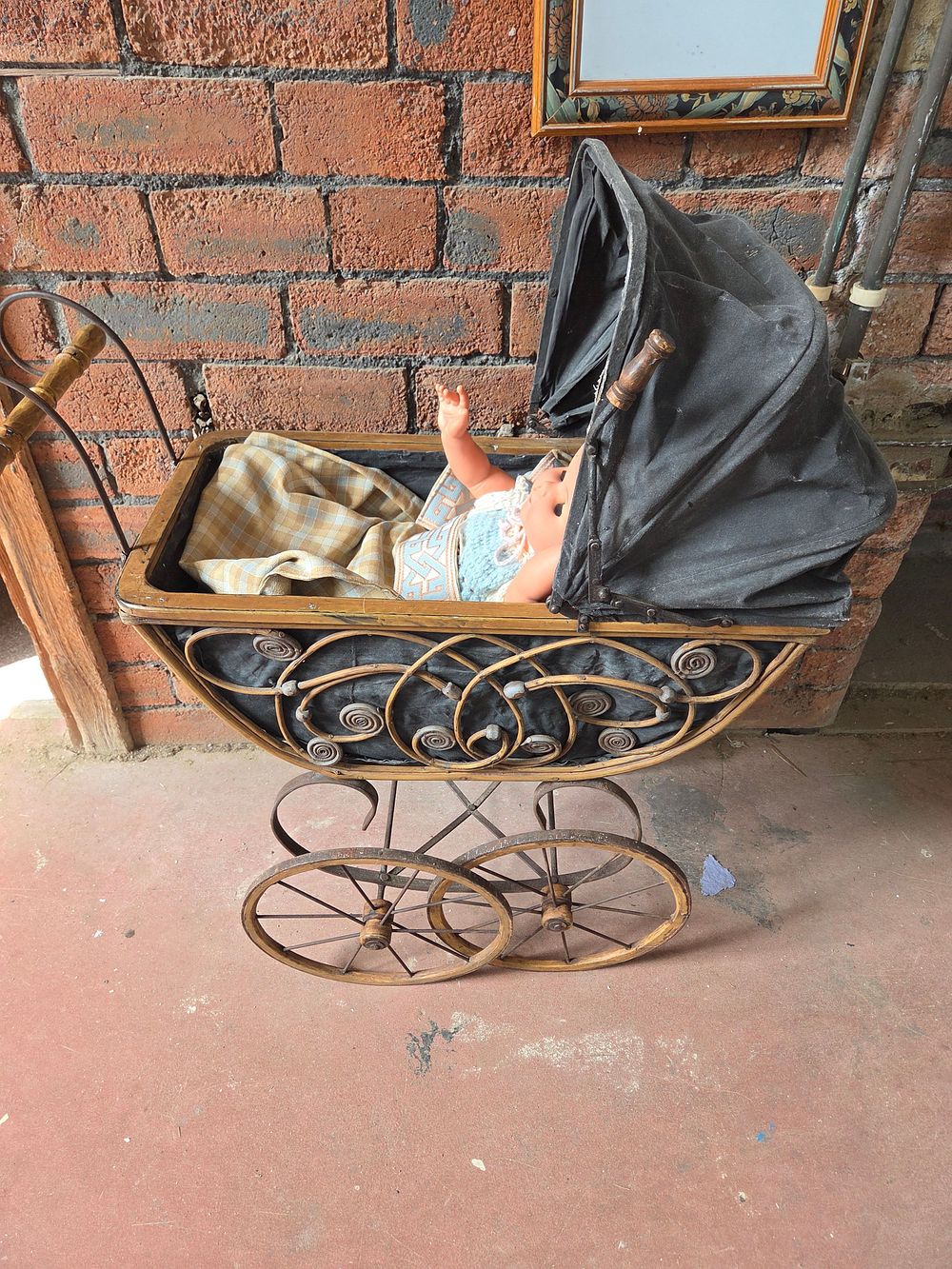 Lot 433 – A Vintage Baby Doll and Wicker Carriage