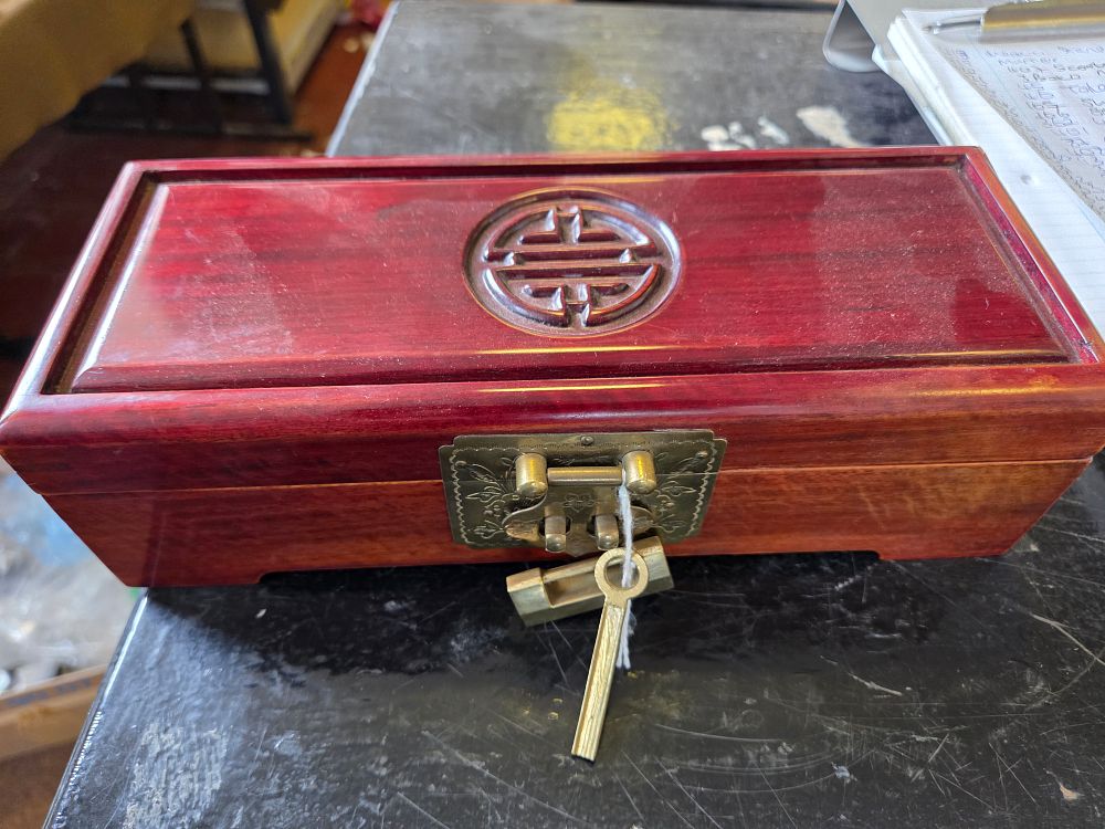 Lot 643 – A Chinese Hardwood Jewellery Box with Brass Fittings and Shou Symbol