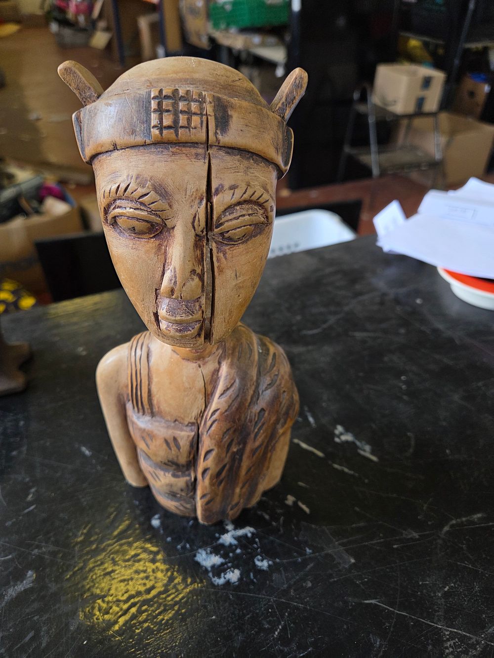 Lot 646 – A hand-carved wooden bust of a figure in the West African style