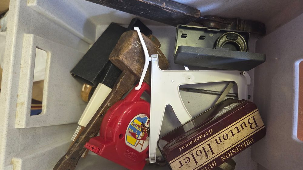 Lot 187 – An Assortment of Vintage and Modern Tools and Accessories Including a Woodworking Mallet and Sewing Attachment Tin