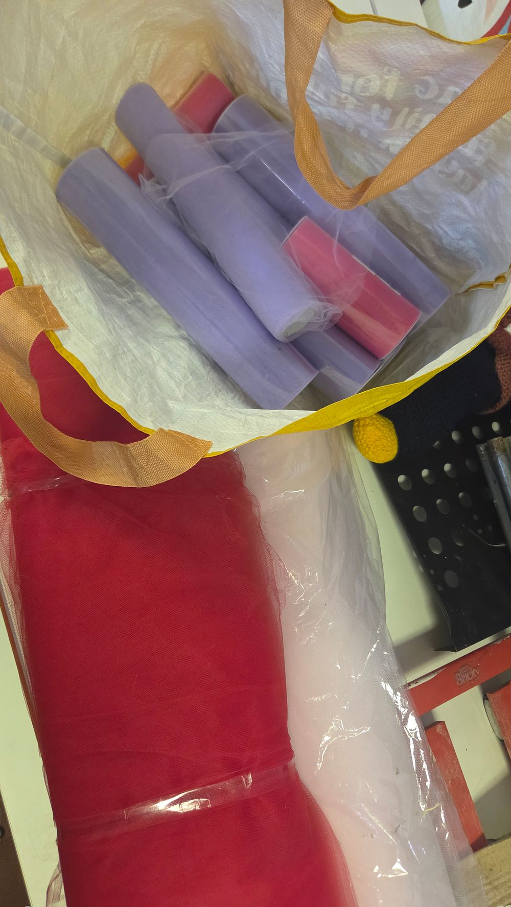 Lot 216 – An Assortment of Decorative Tulle Fabric Rolls in Various Colours