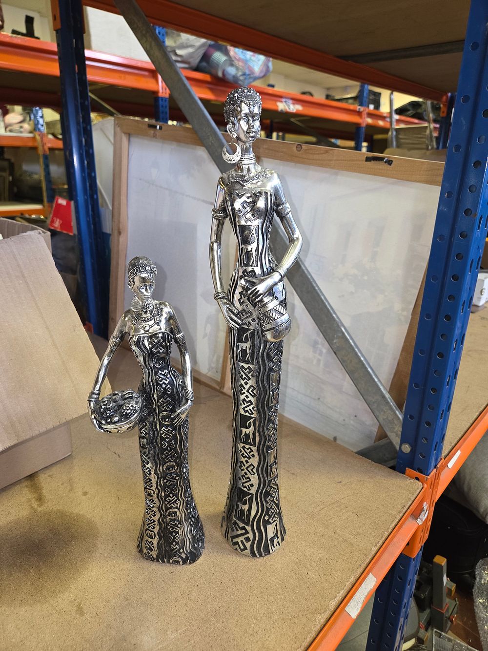 Lot 271 – A Pair of Silver-Toned Decorative African Style Figurines
