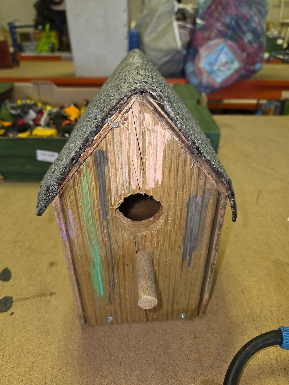 Lot 281 – A Rustic Handmade Painted Wooden Birdhouse