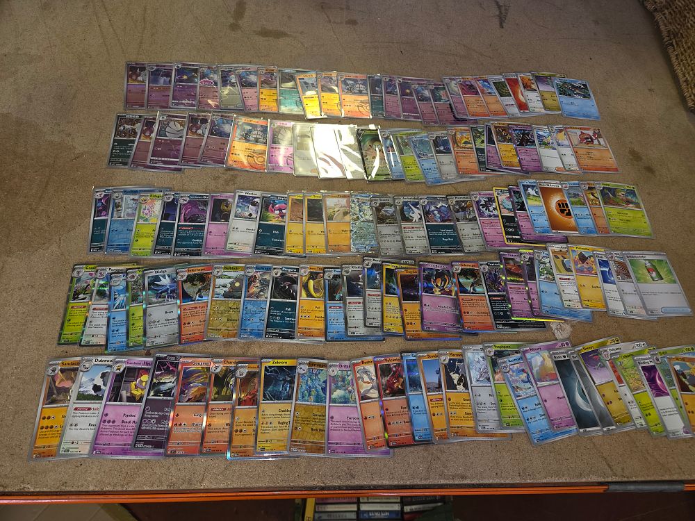 Lot 293 – An Assortment of Approximately 130–150 International Pokémon Trading Card Game Cards Including Modern Holofoil and Classic Collection Reprints