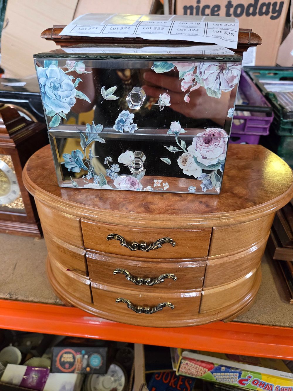 Lot 318 – Two decorative tabletop jewellery chests including a wooden burlwood-style chest and a mirrored floral chest
