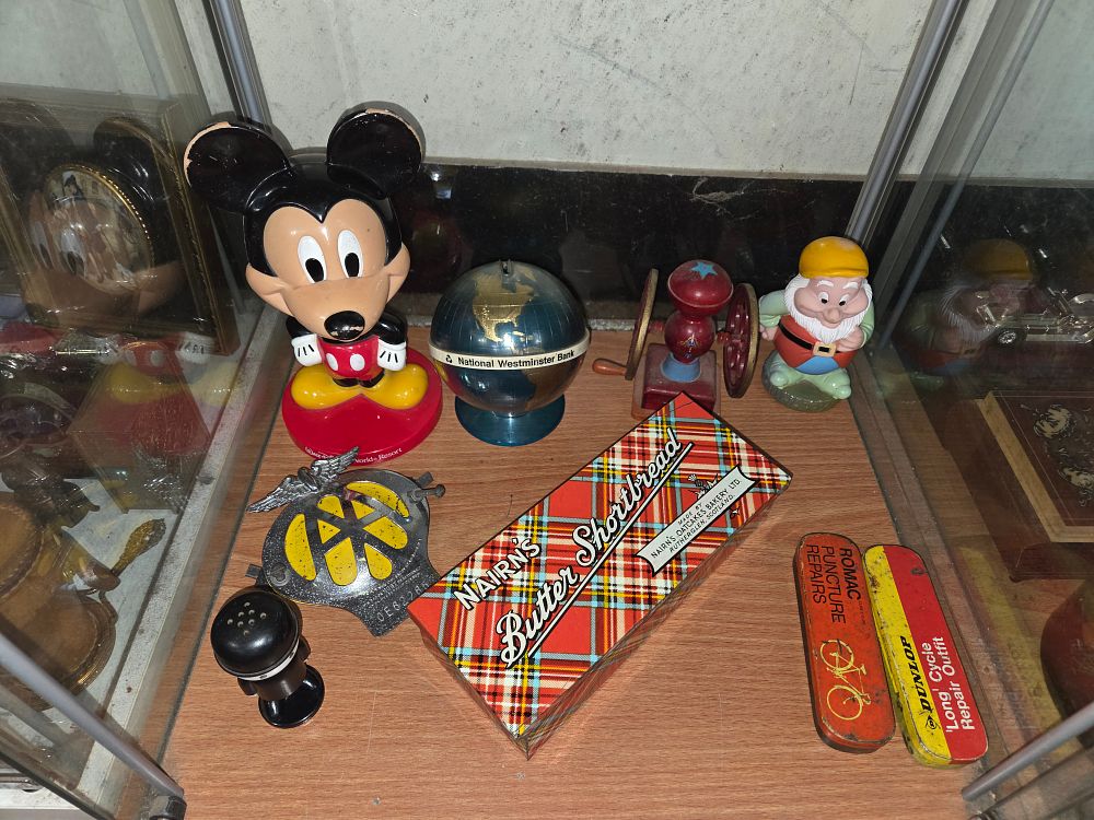 Lot 607 – A Collection of Vintage Toys, Advertising Tins, and Automobilia including Disney Collectibles