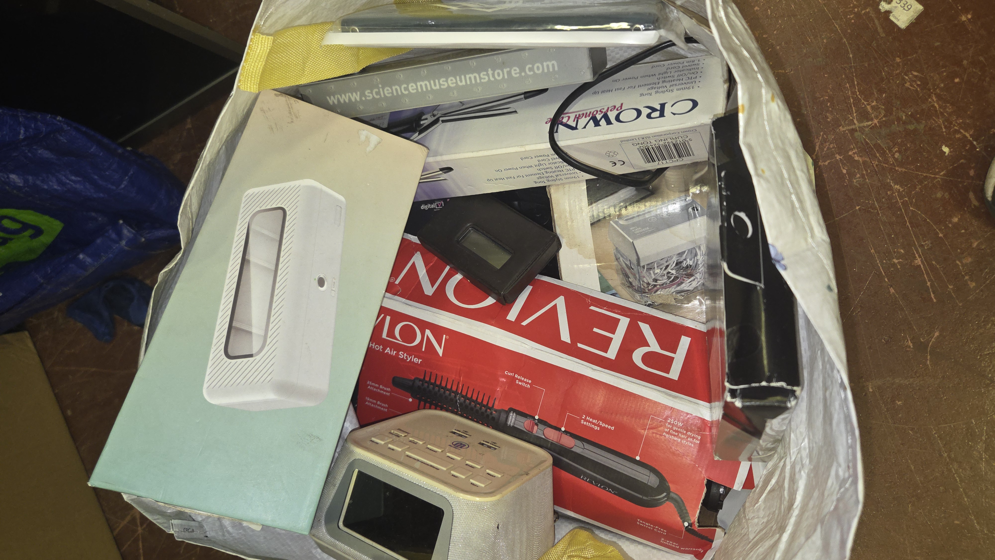 An Assortment of Boxed and Unboxed Personal Care Appliances and Household Electronics