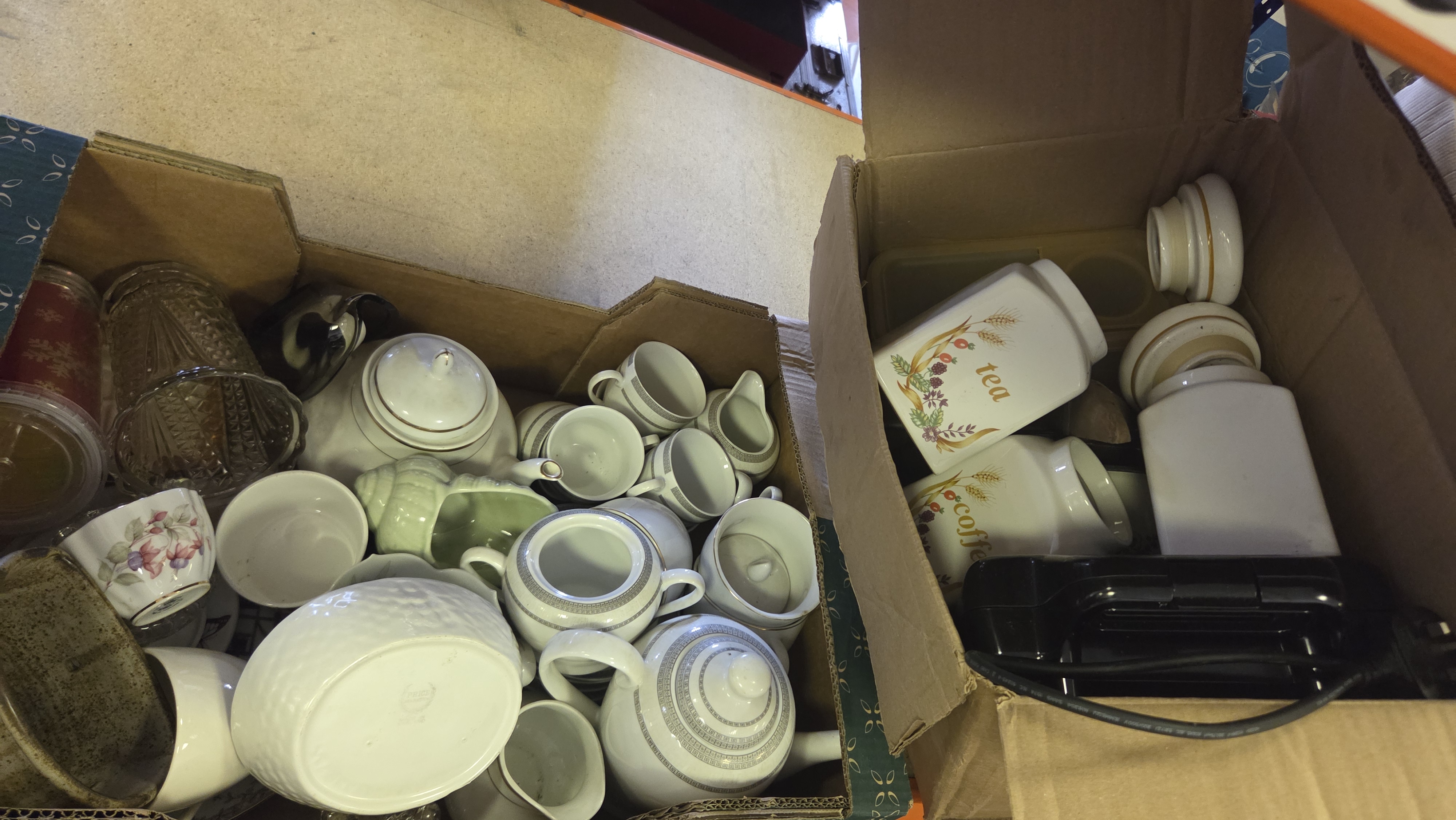 Two Boxes of Ceramic Tea and Kitchen Wares, Glassware, and a Small Kitchen Appliance