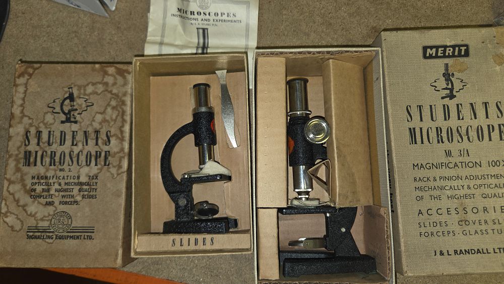 Lot 180 – Two Boxed Mid-Century British Student Microscopes by S.E.L. and Merit