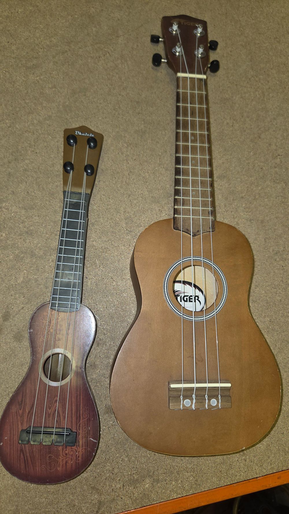 Lot 182 – Two Ukuleles including a Tiger Soprano Model