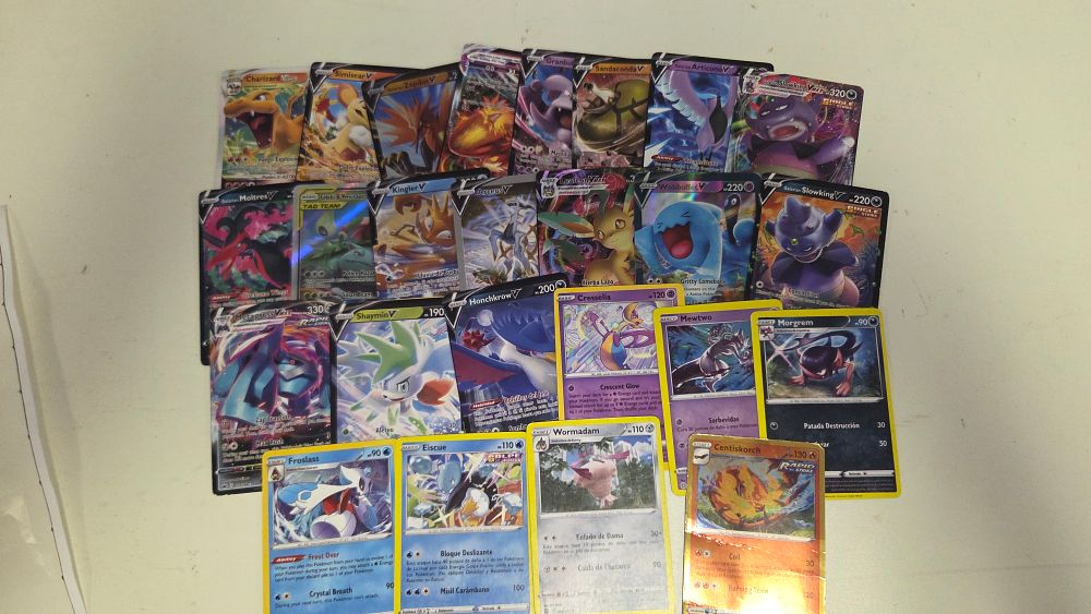 Lot 308 – A Collection of 23 Pokémon Trading Cards including Charizard VSTAR and Metagross VMAX