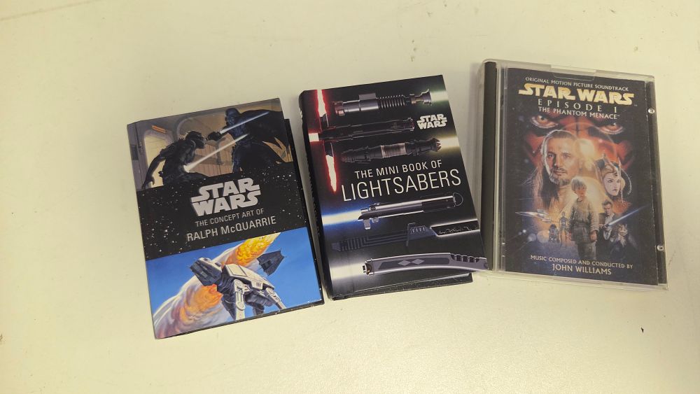 Lot 310 – A Trio of Star Wars Collectibles including Insight Editions Mini Books and Episode I MiniDisc Soundtrack