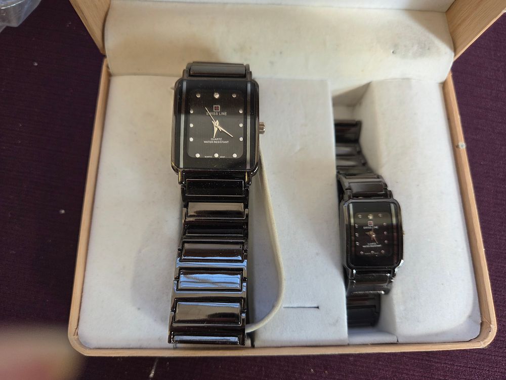 Lot 610 – A Pair of Swiss Line Quartz Wristwatches with Presentation Box