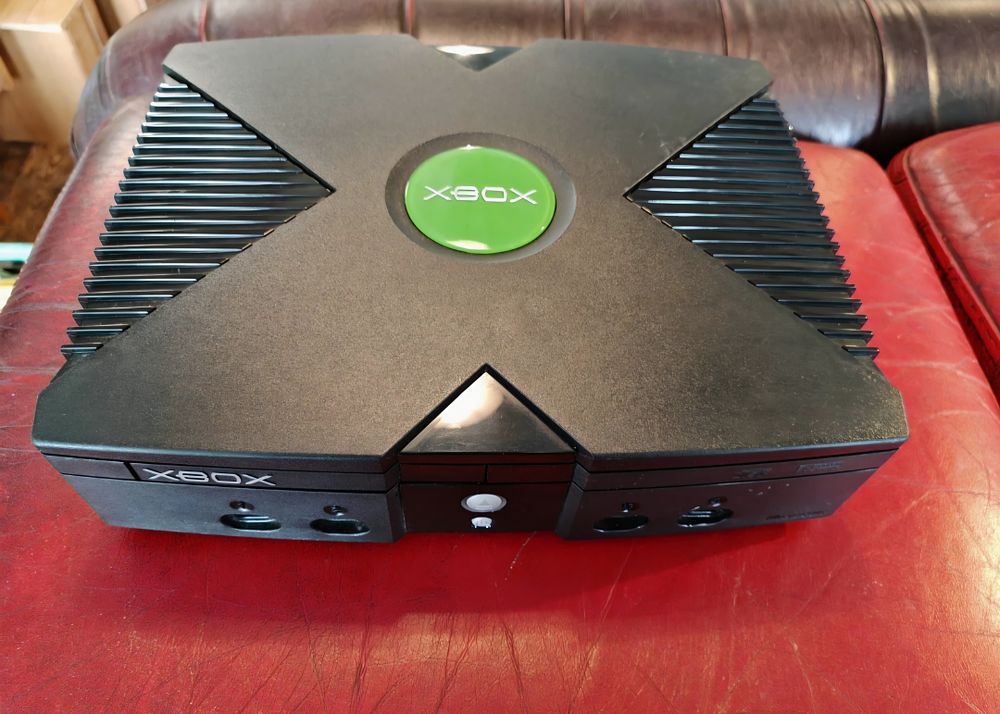 Lot 386 – Microsoft Xbox Original Video Game Console with a Pair of Controller S Pads and Cables full working order