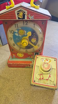 A Pair of Vintage Fisher-Price Musical Toys including Teaching Clock Model 998
