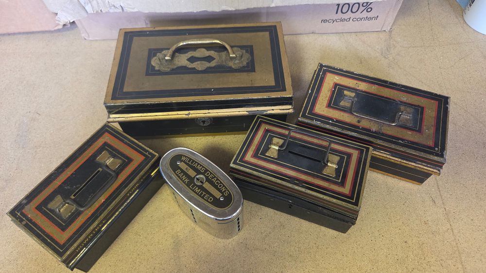 Lot 189 – A Collection of Vintage British Savings Banks including Williams Deacon’s Bank Recording Bank and Rowntree’s Advertising Banks