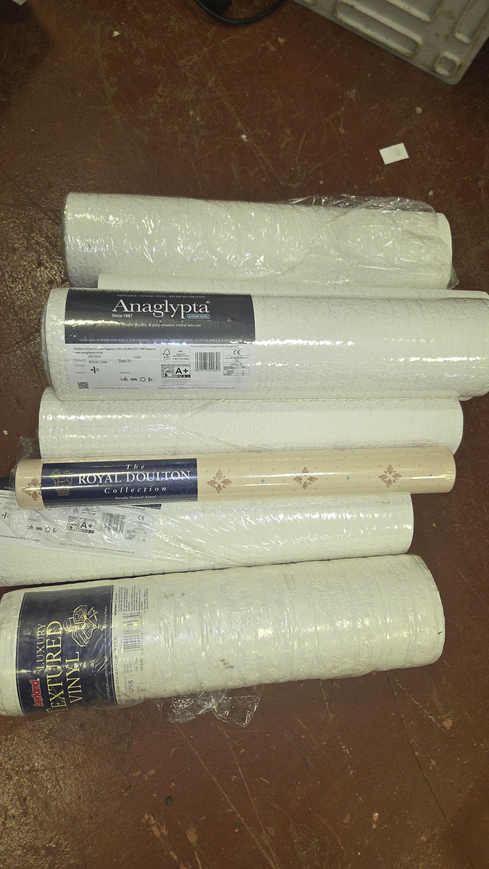 Lot 213 – A Collection of Assorted Textured Vinyl Wallpaper Rolls including Anaglypta, Royal Doulton, and Leyland