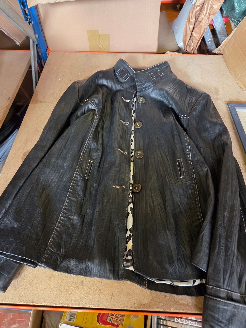 Lot 270 – A Rosso Black Leather Jacket with Leopard Print Lining