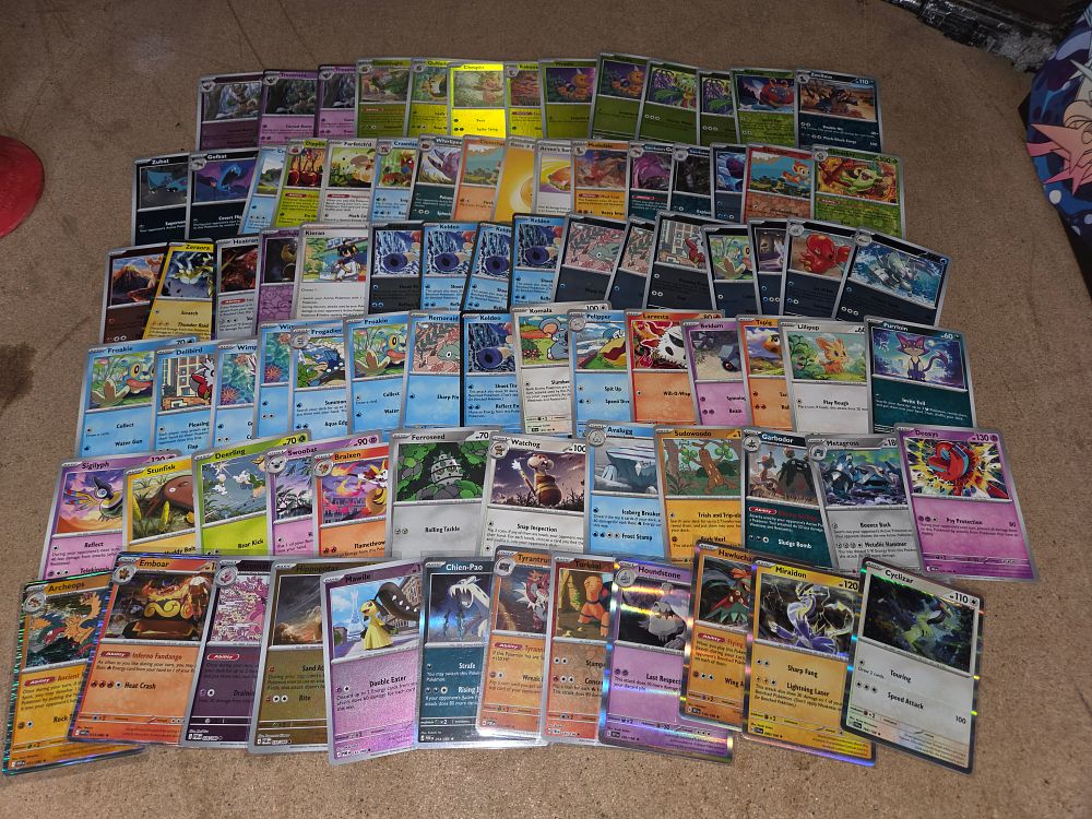 Lot 315 – A Collection of Pokémon Trading Cards from Multiple Eras Including Scarlet and Violet, Black and White, and XY