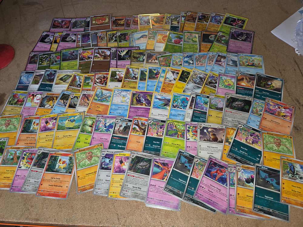 Lot 318 – An Assortment of Modern Pokémon Trading Cards Including Holographic and Rare Variants