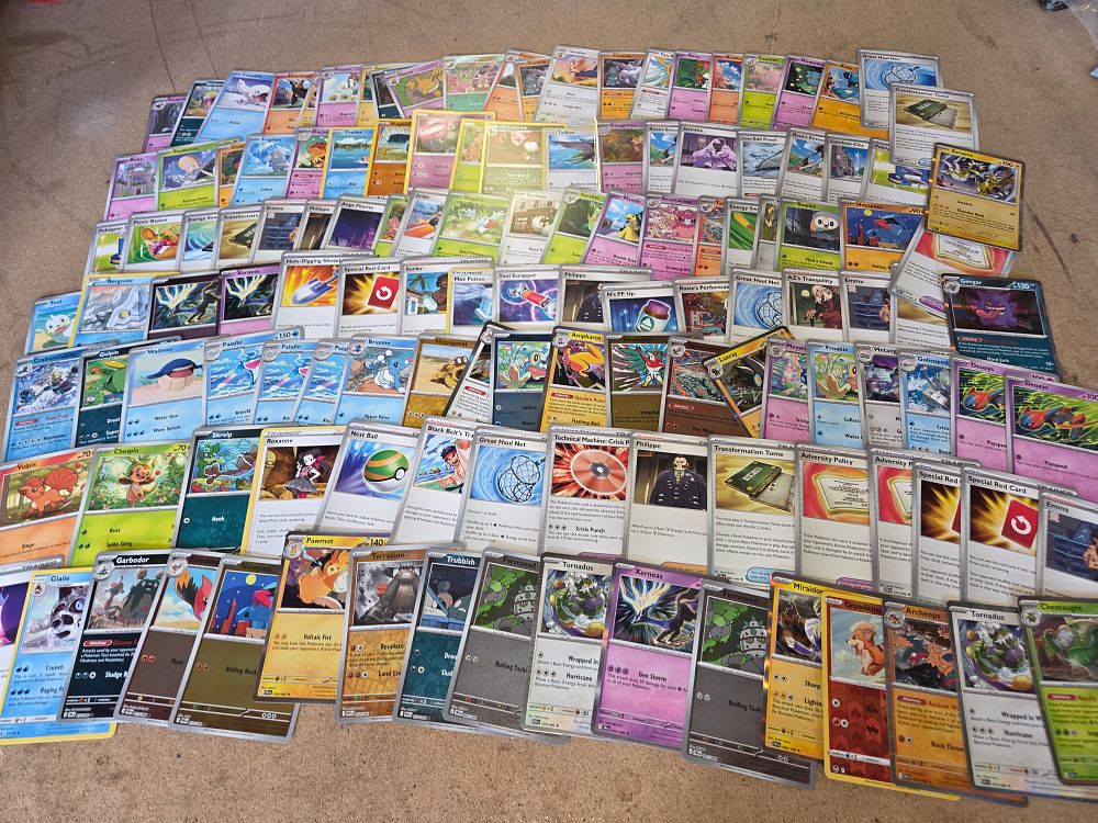 Lot 319 – A Collection of Modern English Pokémon TCG Trading Cards Featuring Holo Rare and Reverse Holo Examples
