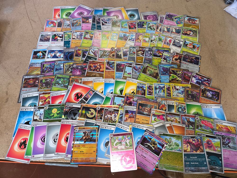 Lot 321 – A Collection of over 150 Multilingual Pokémon Trading Cards Including Holographic and Energy Variants