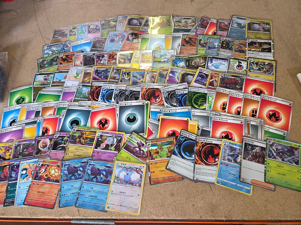 Lot 322 – A Collection of Modern Pokemon Trading Cards Featuring Korean Japanese and English Language Issues