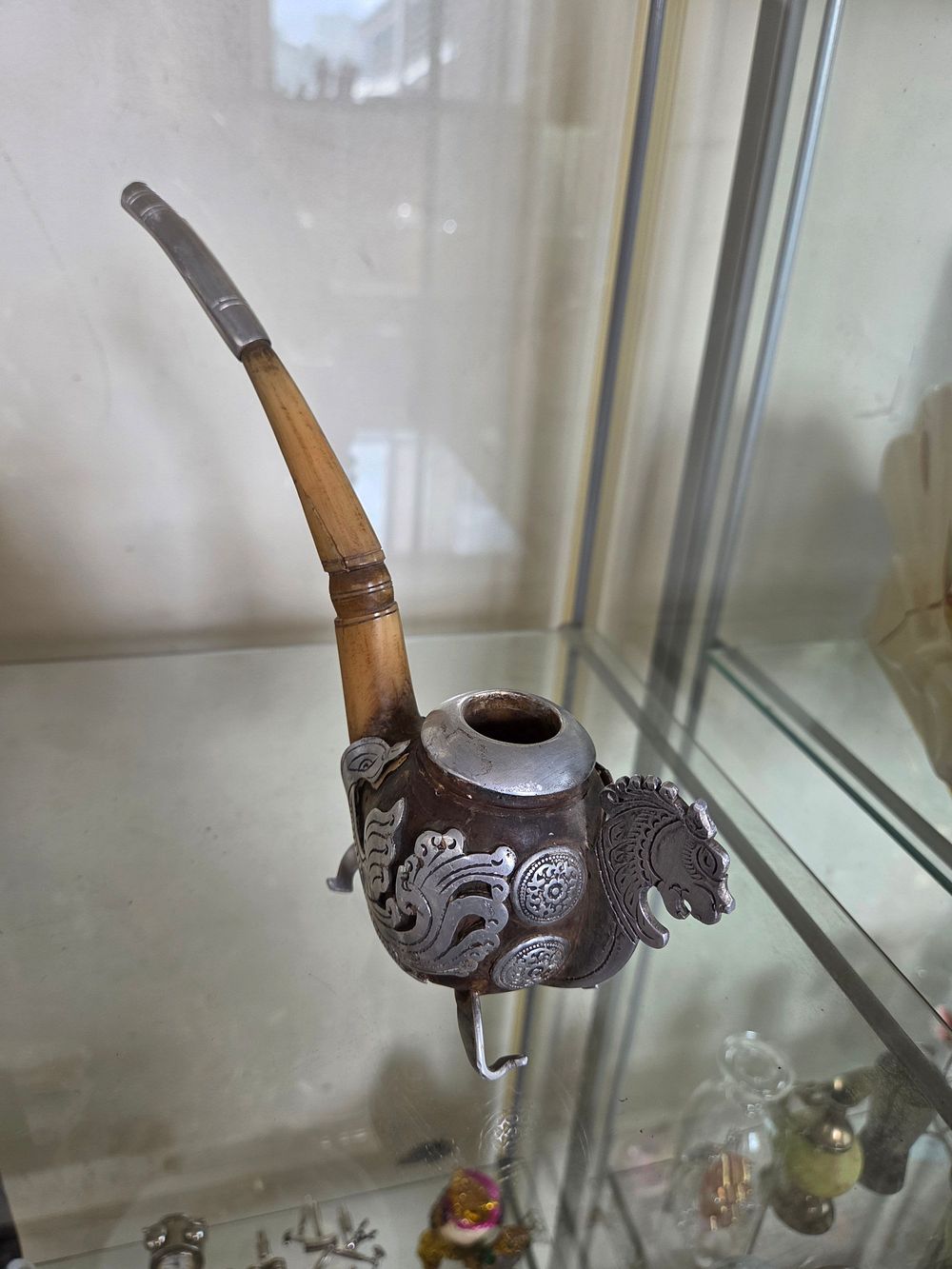 Lot 602 – A Tibetan White Metal Mounted and Bone Stemmed Decorative Pipe
