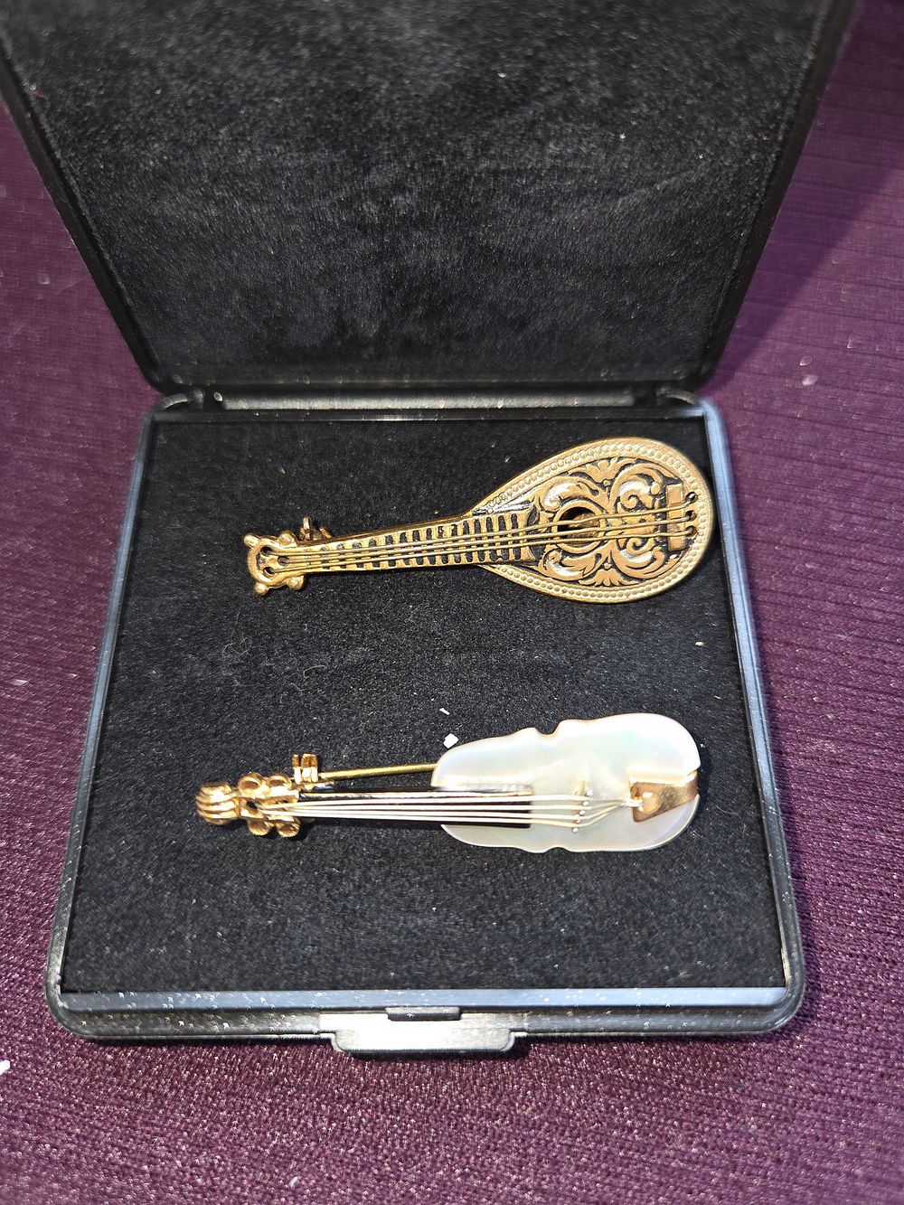Lot 639 – A Pair of Antique Gold-tone and Mother-of-Pearl Musical Instrument Brooches Early 1900’s