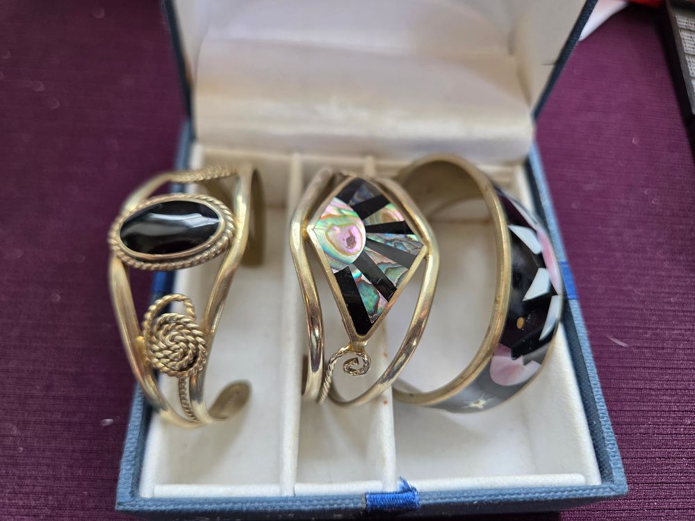 Lot 651 – A Trio of Vintage Mexican Silver and Abalone Shell Inlay Cuff Bracelets 53.89g