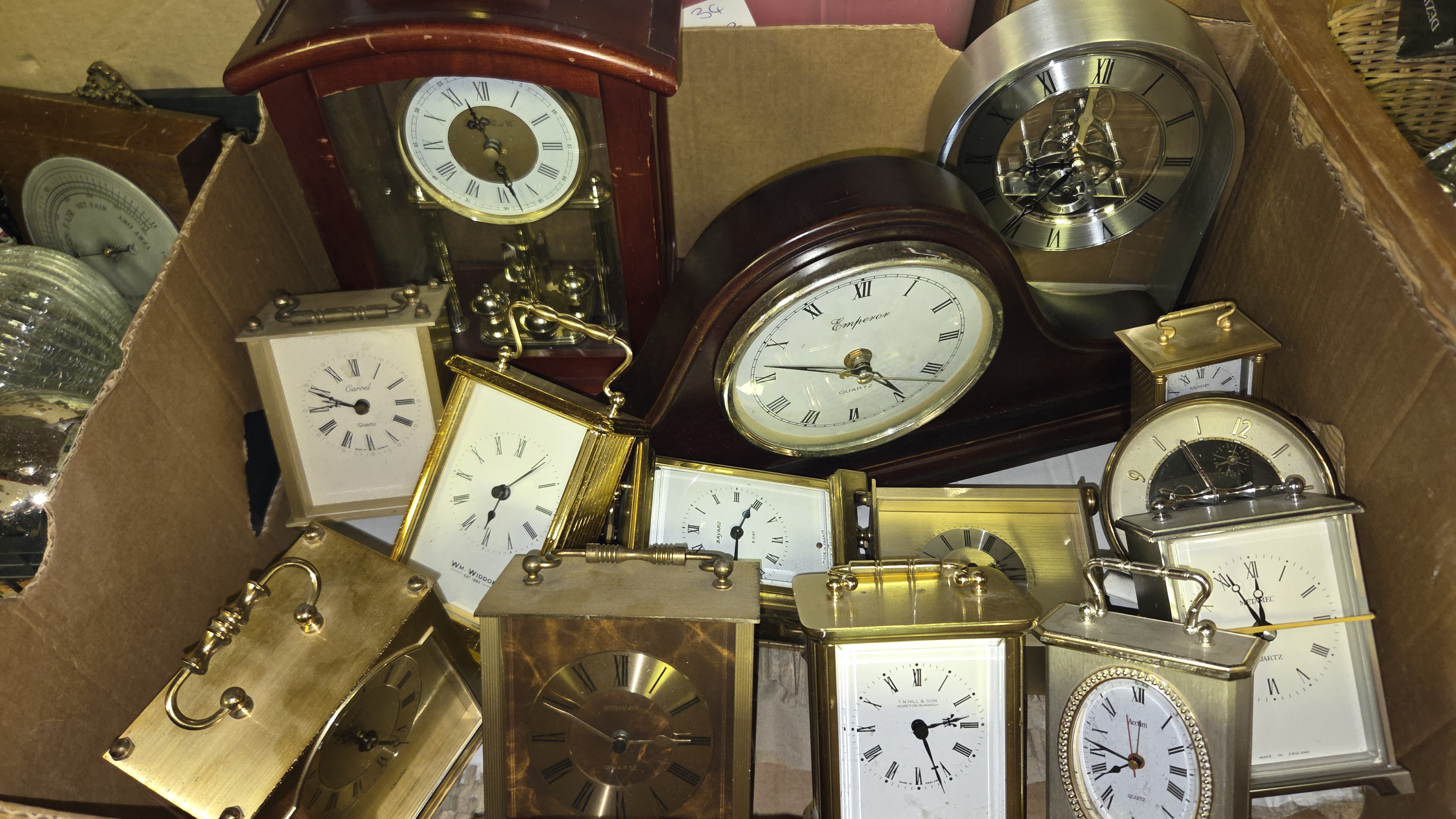 A collection of mantel and carriage clocks to include Metamec, Acctim, and Bayard, and an aneroid barometer