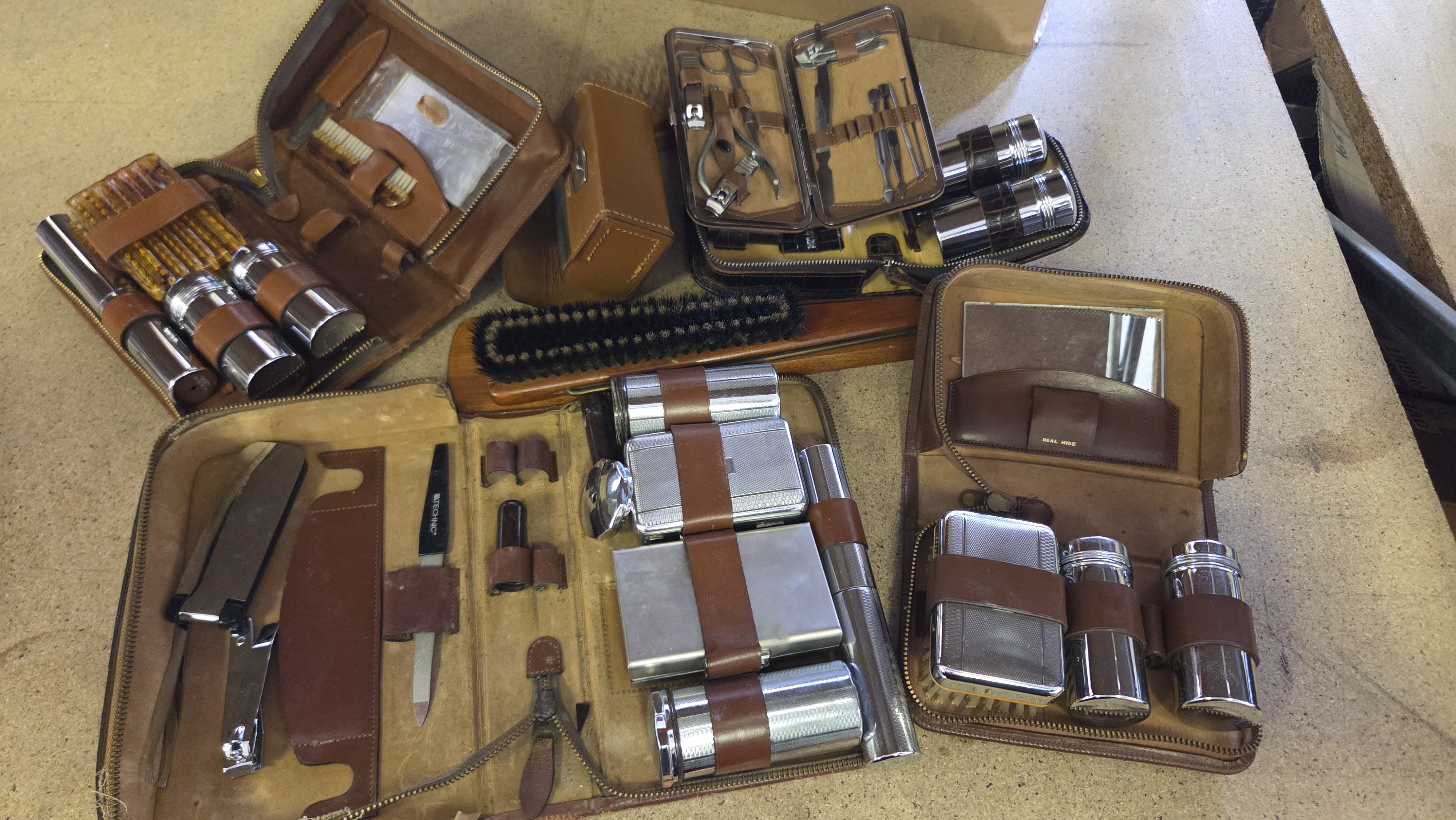 A Collection of Vintage Men's Leather Travel Grooming and Toiletry Sets