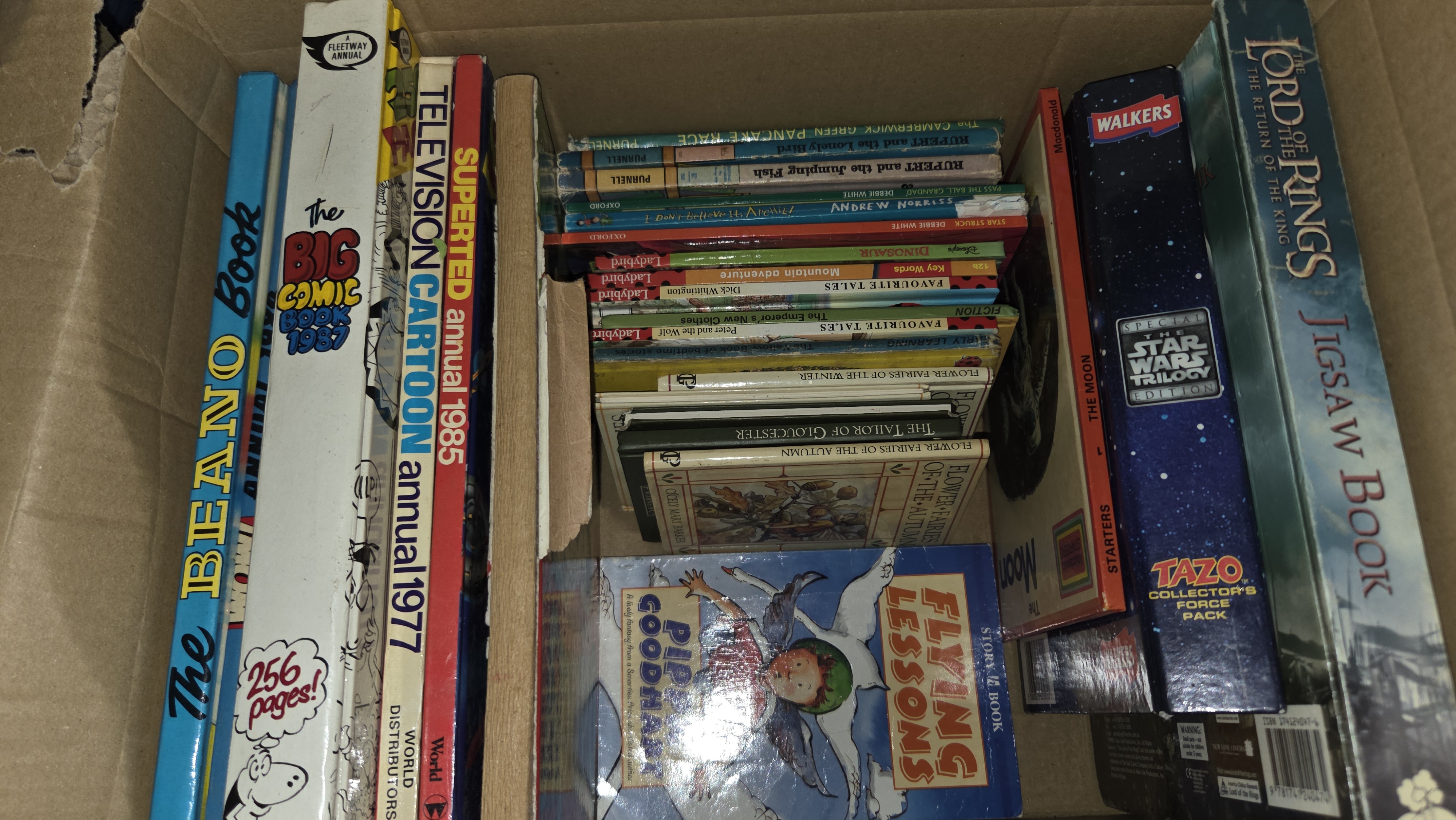 A Collection of Vintage British Children's Annuals, Ladybird Books, and Promotional Media