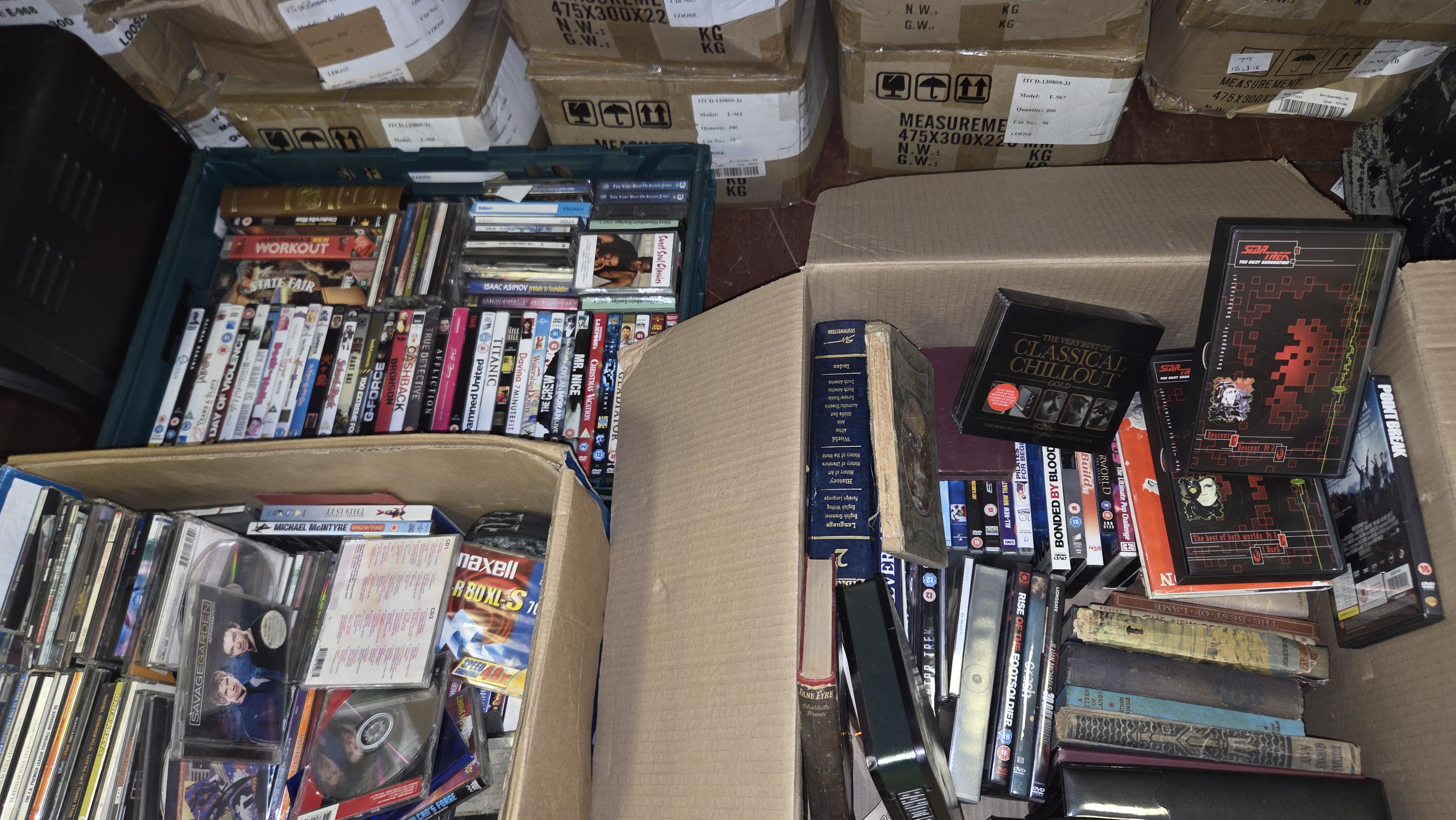 Three Boxes of Mixed Media and Books Including DVDs, CDs, Cassette Tapes, and Hardback Volumes