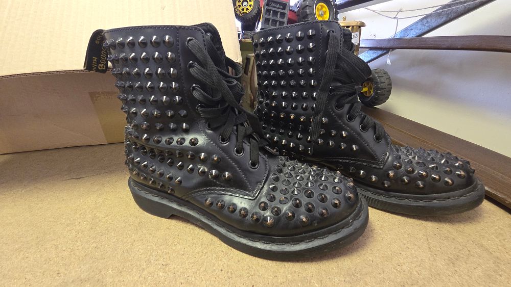 Lot 166 – A Pair of Dr. Martens Black Leather Studded 1460 8-Eyelet Boots size 7