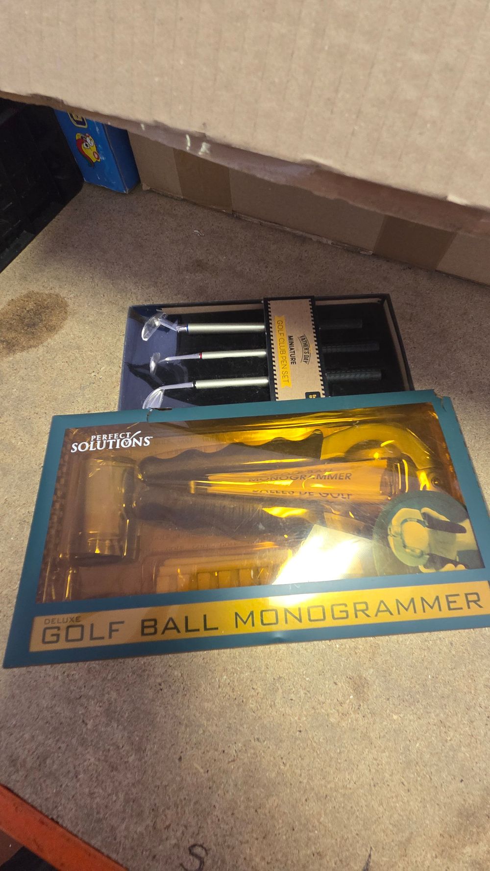 Lot 172 – Two Golf-Themed Gift Sets including a Miniature Golf Club Pen Set and a Perfect Solutions Deluxe Golf Ball Monogrammer