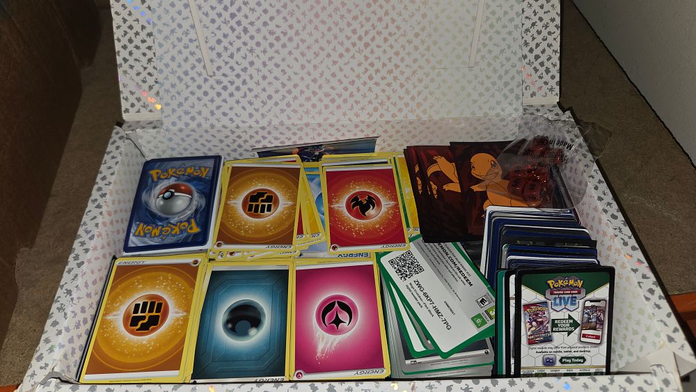 Lot 185 – A Collection of Pokémon TCG Cards and Gameplay Accessories in a Scarlet & Violet 151 Storage Box