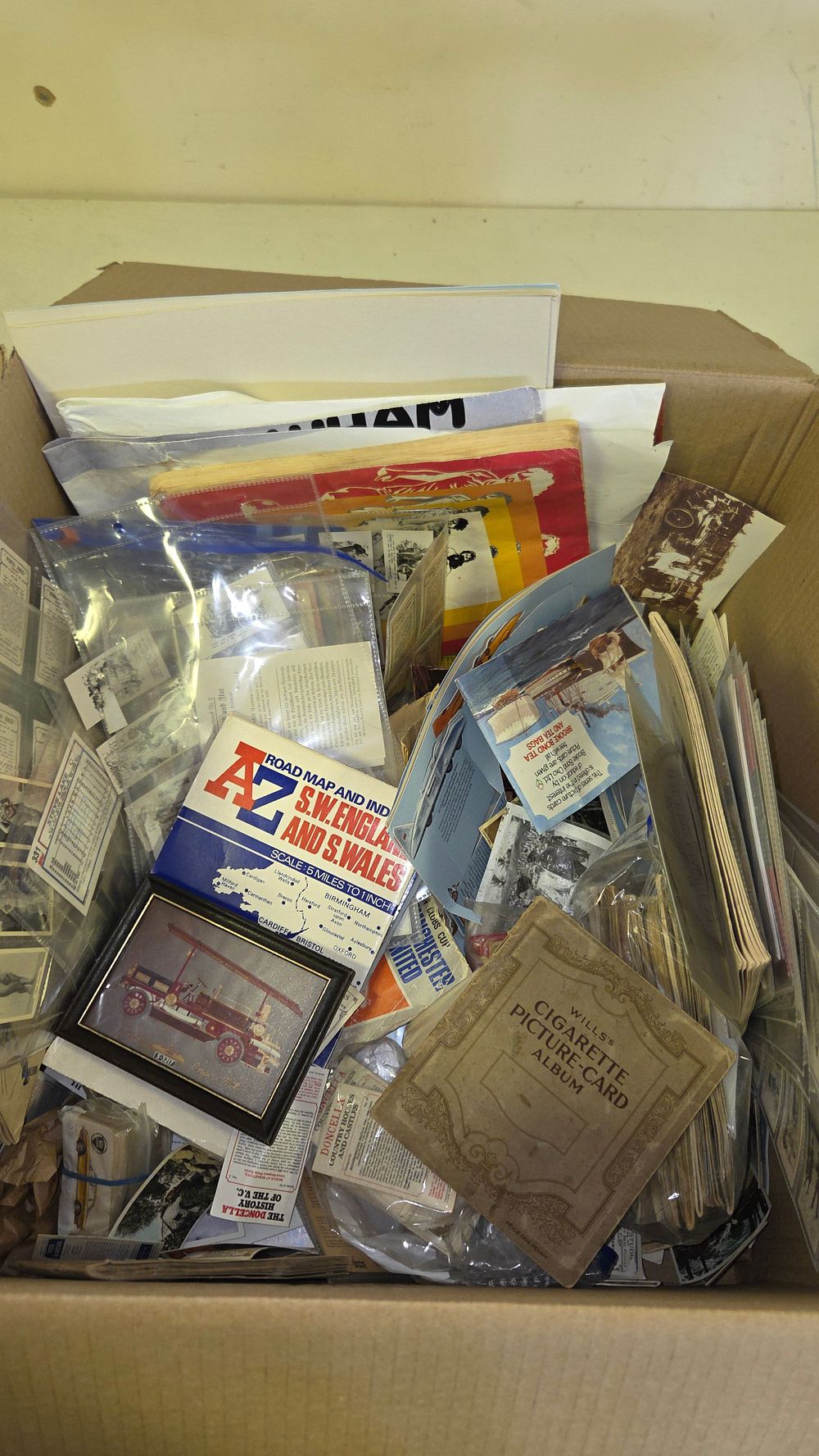 Lot 191 – An Assortment of Ephemera, Cigarette Card Albums, and Road Maps