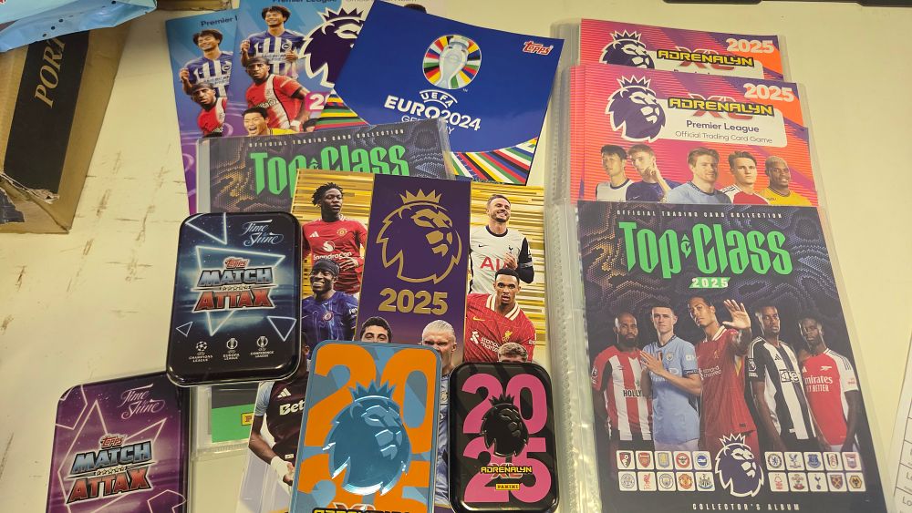 Lot 215 – A Collection of Panini and Topps Football Trading Card Albums, Tins, and McDonald’s Promotional Cards