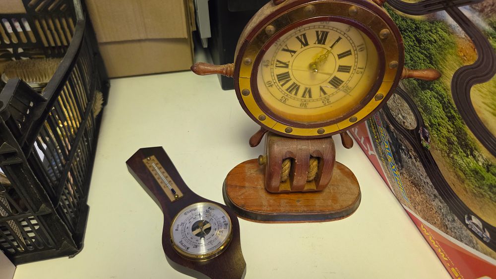 Lot 220 – A Pair of Maritime Themed Desktop Instruments Comprising a Novelty Ship’s Wheel Mantel Clock and a Weathermaster Barometer